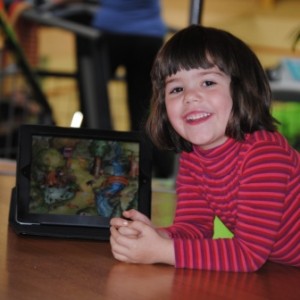 Victoria with iPad at sports